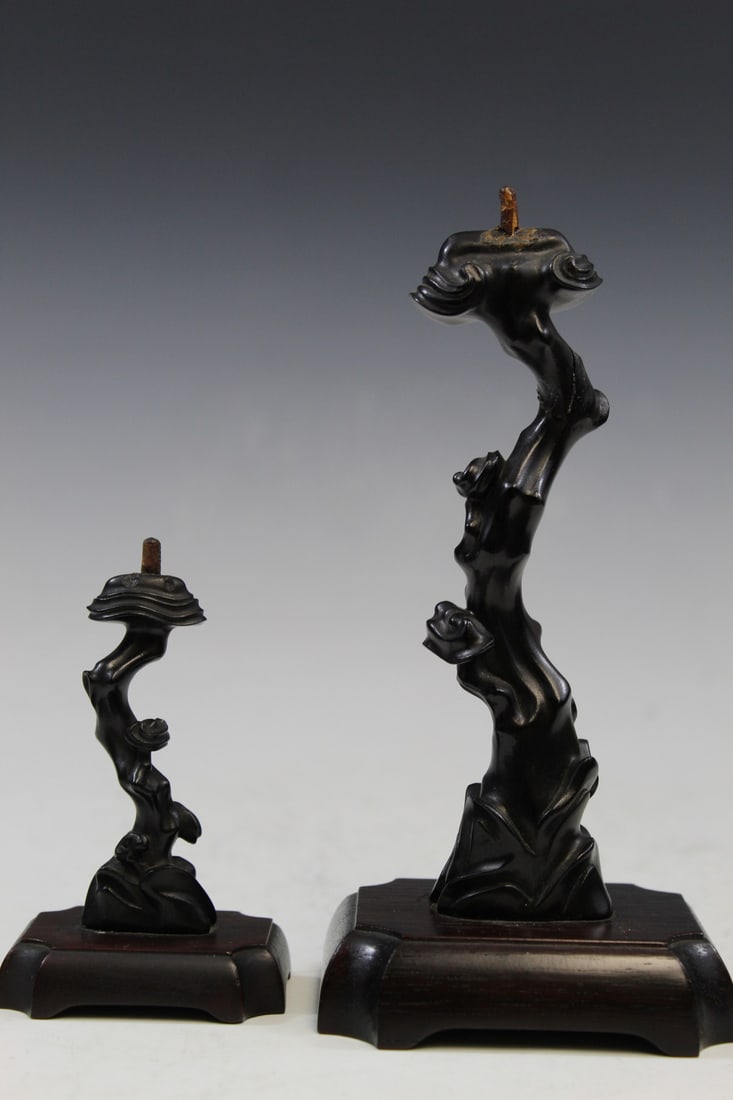 Two Chinese carved Zitan wood candle sticks in Lingzhi shape.: Two Chinese carved Zitan wood candle sticks in Lingzhi shape. H 6 3/4" and 4" with stand. As Is.