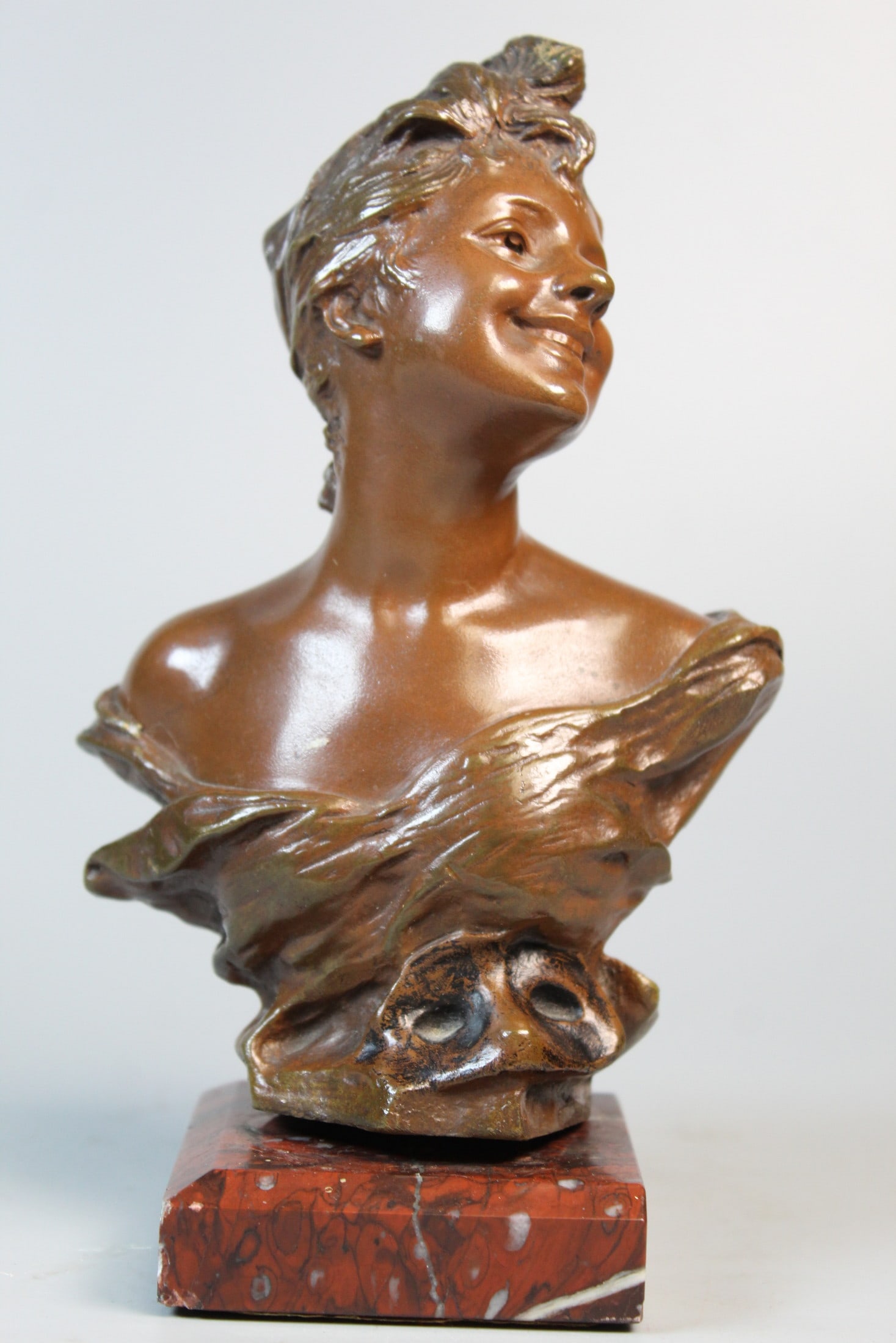 A FRENCH BRONZE BUST OF A GIRL, cast after a model by George van der Straeten (active 1880-1920),: A FRENCH BRONZE BUST OF A GIRL, cast after a model by George van der Straeten (active 1880-1920), the girl in a large hat, signed on the back G. van der Straeten, with stamp 'Societè des Bronzes de