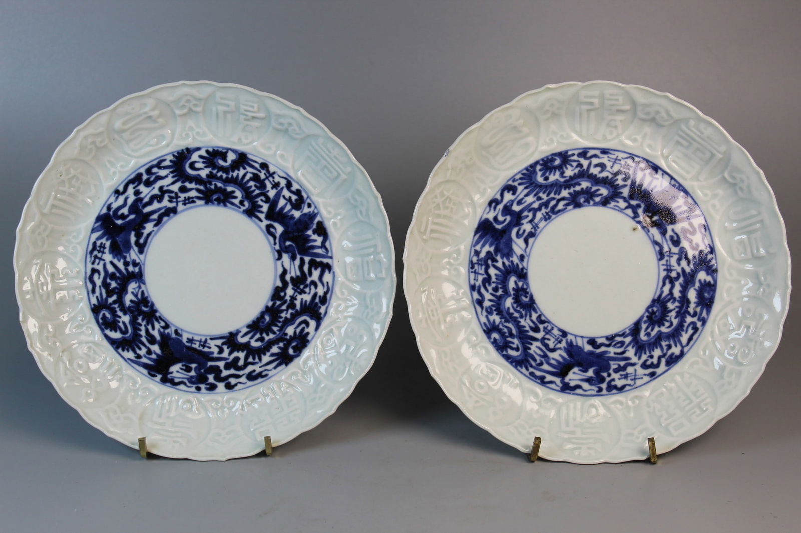 Pair of Japanese Blue and White Dishes with Molded Characters.: Pair of Japanese Blue and White Dishes with Molded Characters.. 19th C. Diam 7.5".