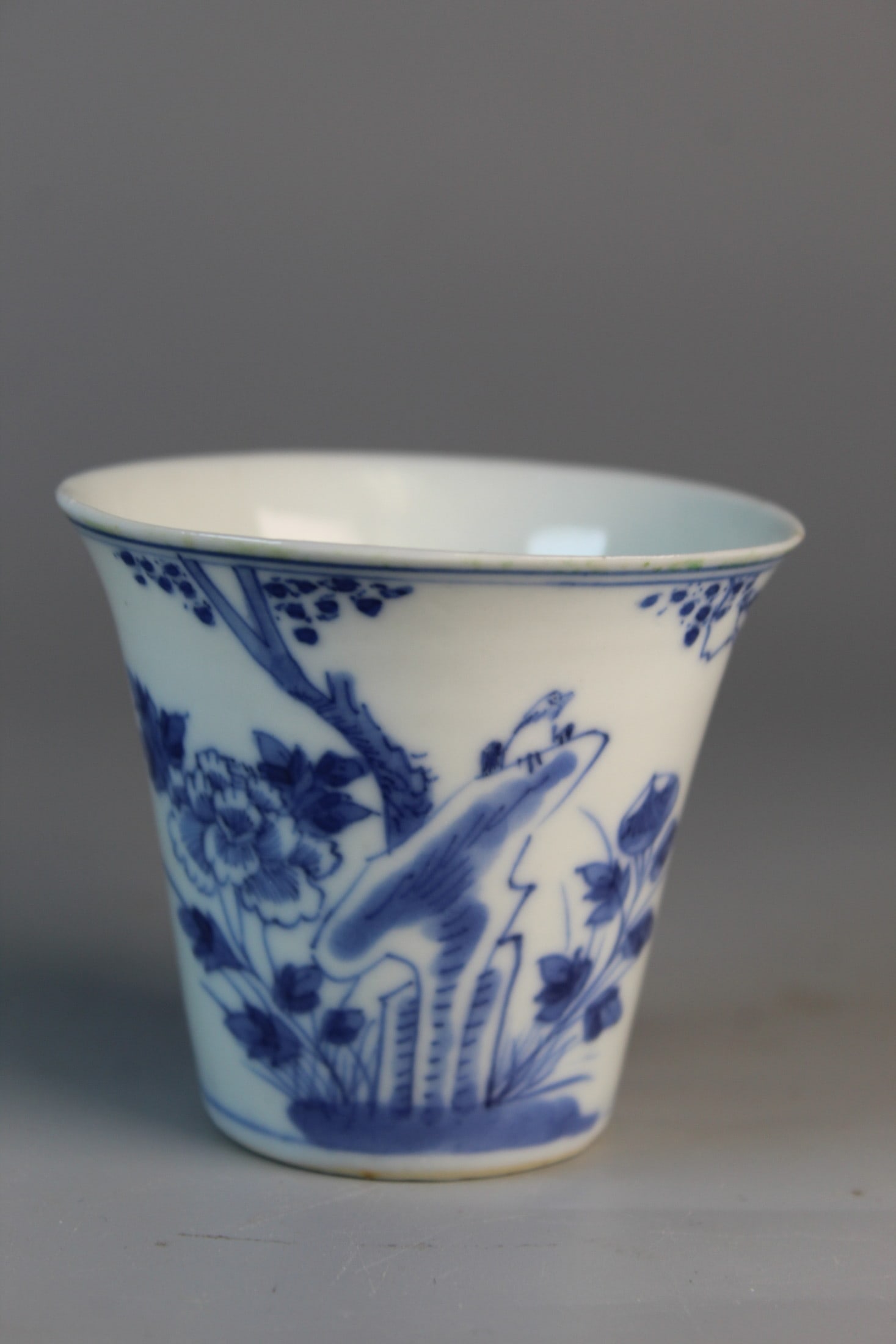 Chinese Blue and White Porcelain Tea Cup: Chinese Blue and White Porcelain Tea Cup. Kangxi Mark, 18th C. H 2.5". Diam 2.75".