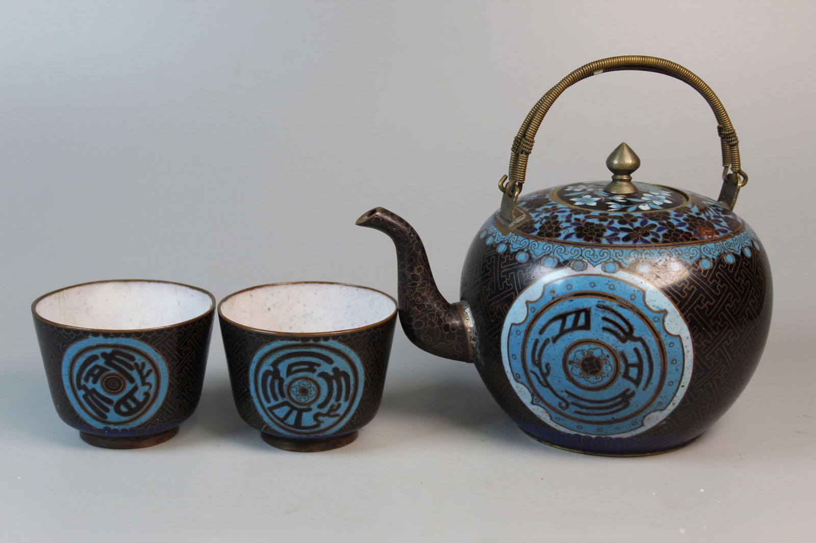 Chinese Cloisonne Teapot and Two Cups: Chinese Cloisonne Teapot and Two Cups. L 6.75". Cup H 2.25".