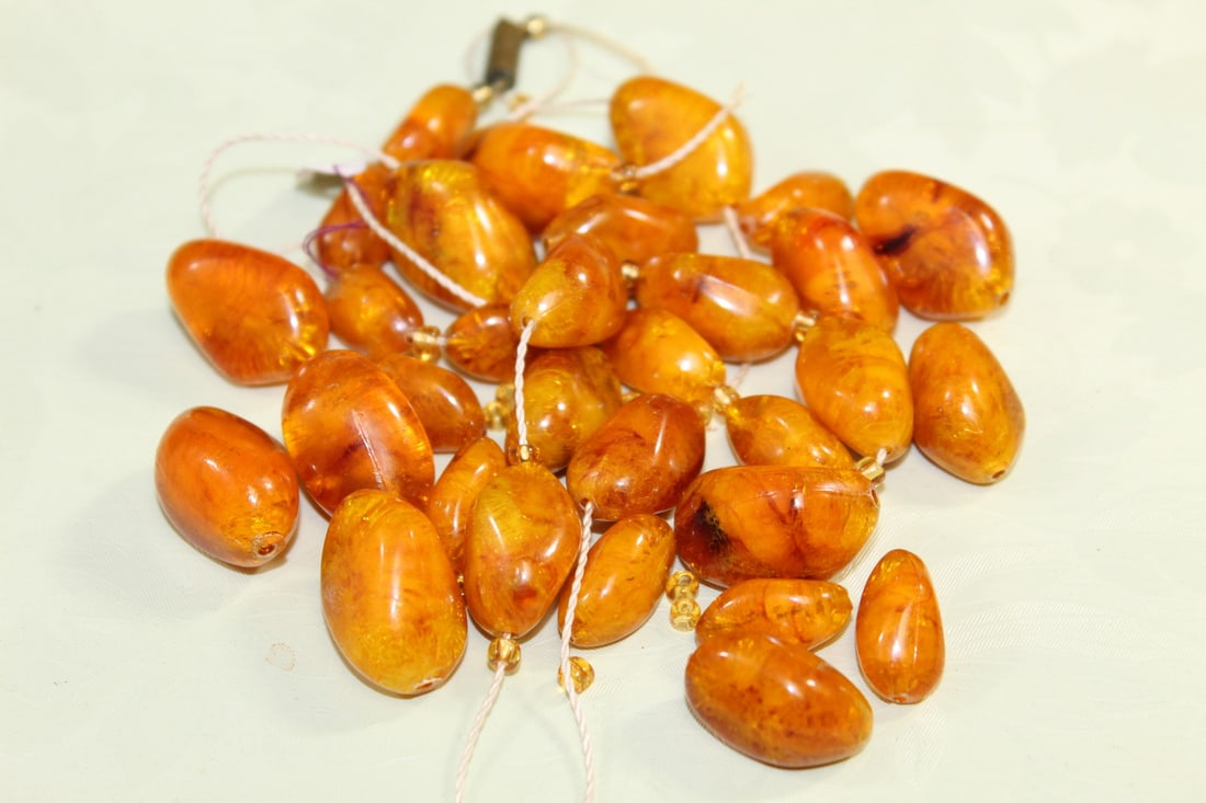 Amber-like Beads: Amber-like Beads. Largest L 3/4".
