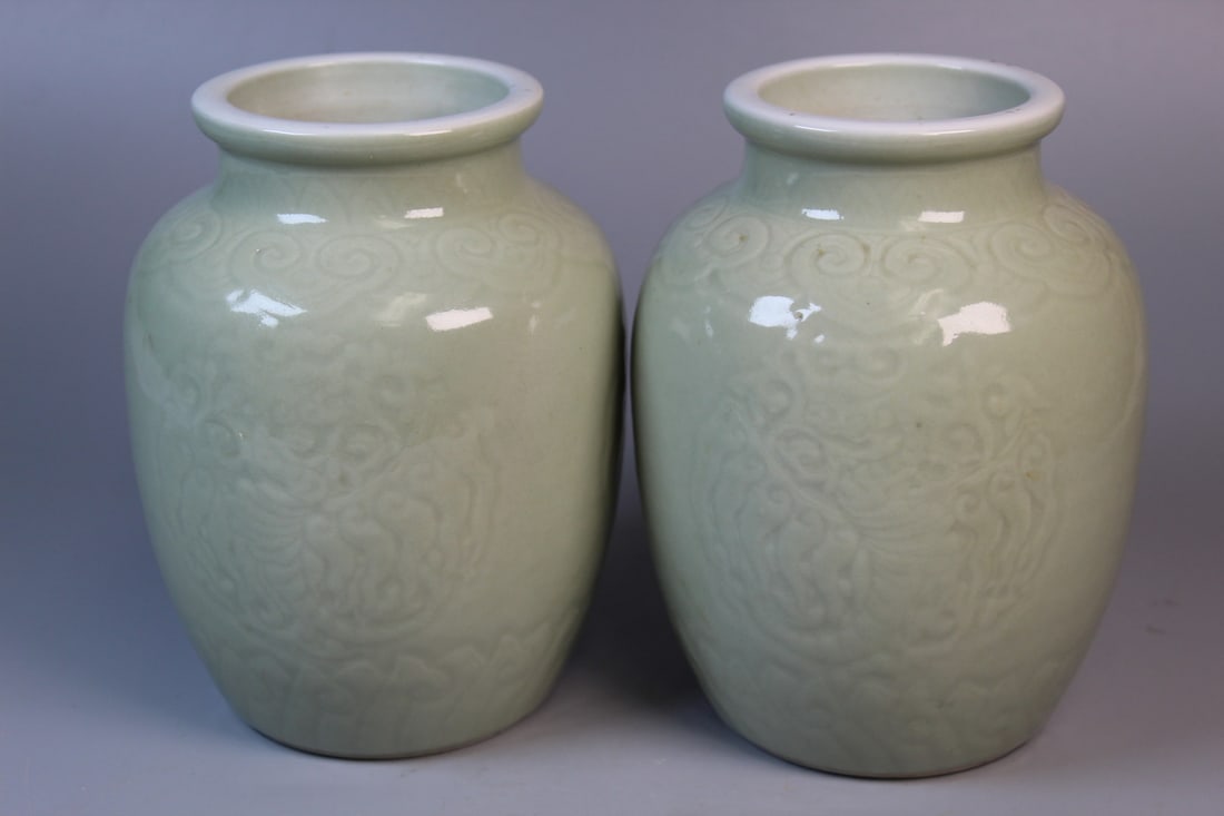 Pair of Chinese Celadon Glazed Porcelain Vases: Pair of Chinese Celadon Glazed Porcelain Vases. H 6.75". Diam 4.75". As Is.