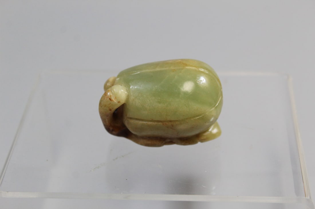 Chinese Green and Russet Jade Melon Pendant: Chinese Green and Russet Jade Melon Pendant. H 1.5".
