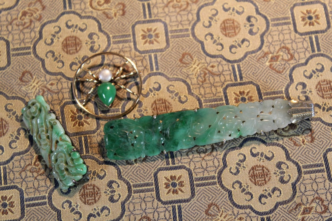 Chinese Carved Jadeite and Silver Pins: Chinese Carved Jadeite and Silver Pins. Largest length 3". Round pin diam 1".