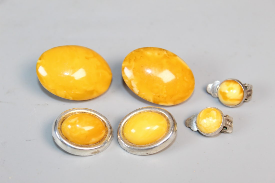 Three Pairs of Amber Clip Earrings: Three Pairs of Amber Clip Earrings. Largest 1.25".