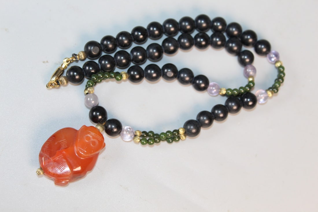 Black Beads Necklace withe Chinese Carved Red Agate Pendant: Black Beads Necklace withe Chinese Carved Red Agate Pendant. L 16". Pendant L 1.25".