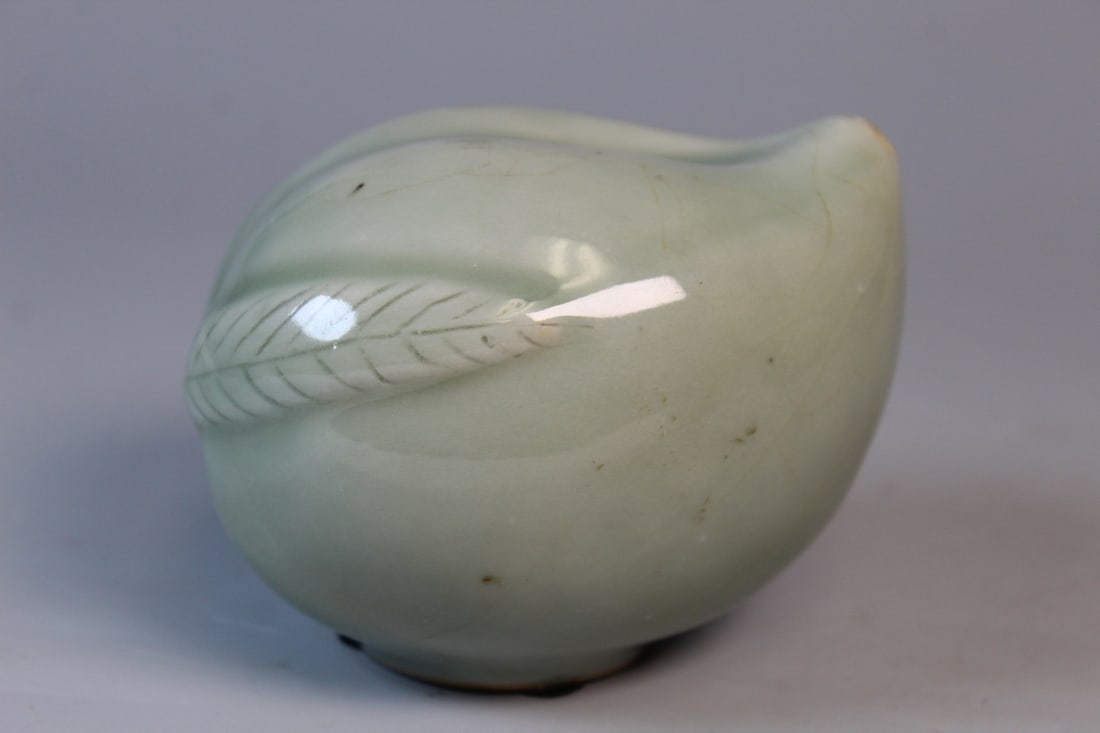 Celadon Glazed Peach Shaped Porcelain Water Dropper.: Celadon Glazed Peach Shaped Porcelain Water Dropper.. L 3.5".