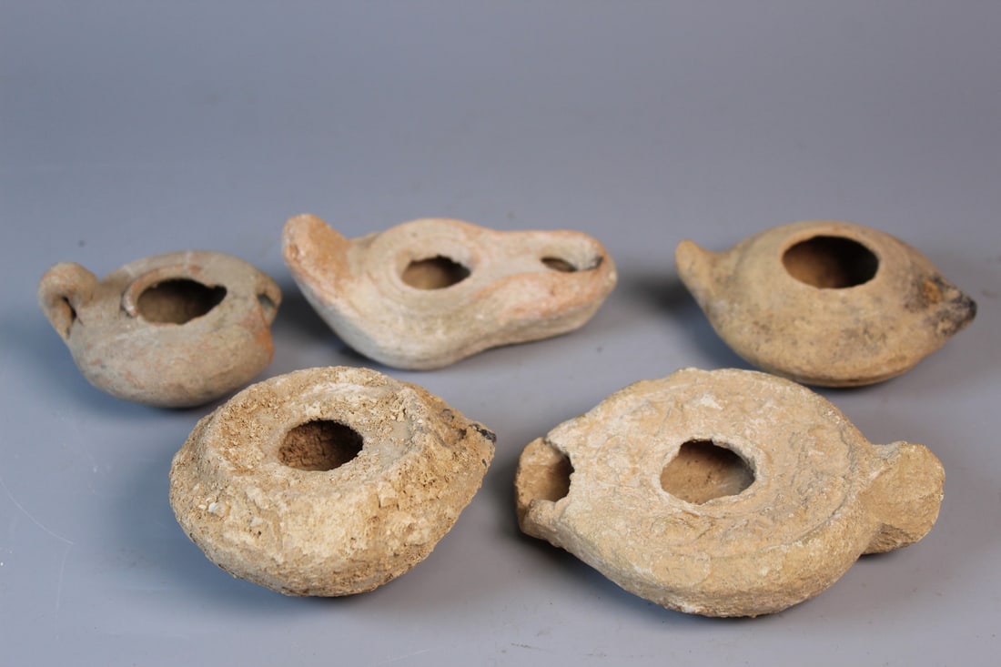 A Group of Antique Terracotta Oil Lamps: A Group of Antique Terracotta Oil Lamps. Largest L 4.25". As Is.