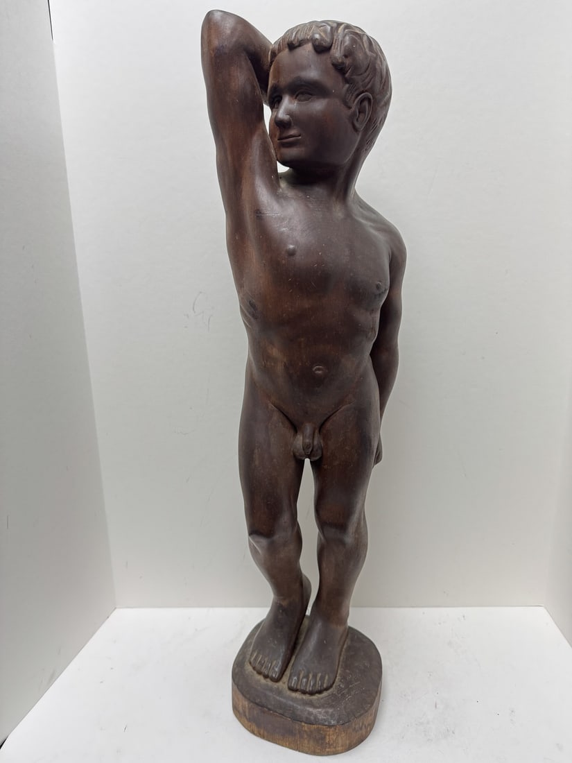 Wood sculpture of a young man (1 of 3)