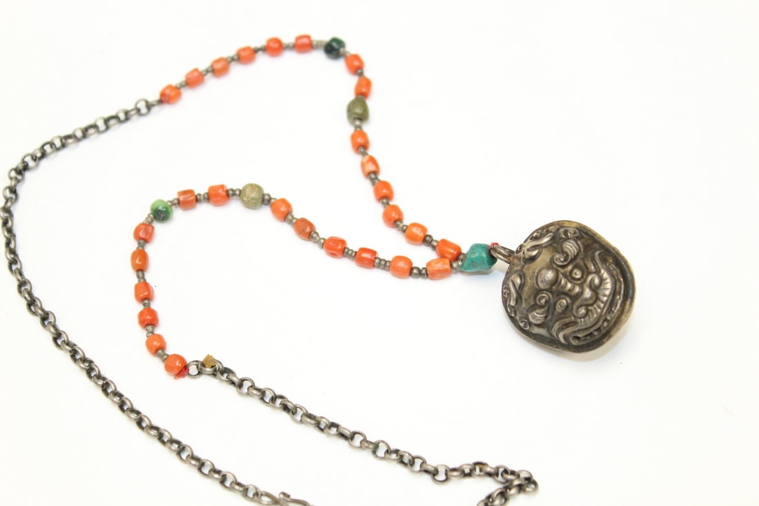 Chinese red coral bead necklace with silver pendant: Chinese red coral bead necklace with silver pendant. Length 11"