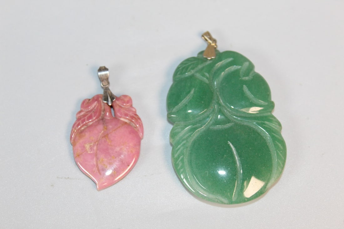 Two Chinese Carved Stone Pendants: Two Chinese Carved Stone Pendants. Larger L 2.25".