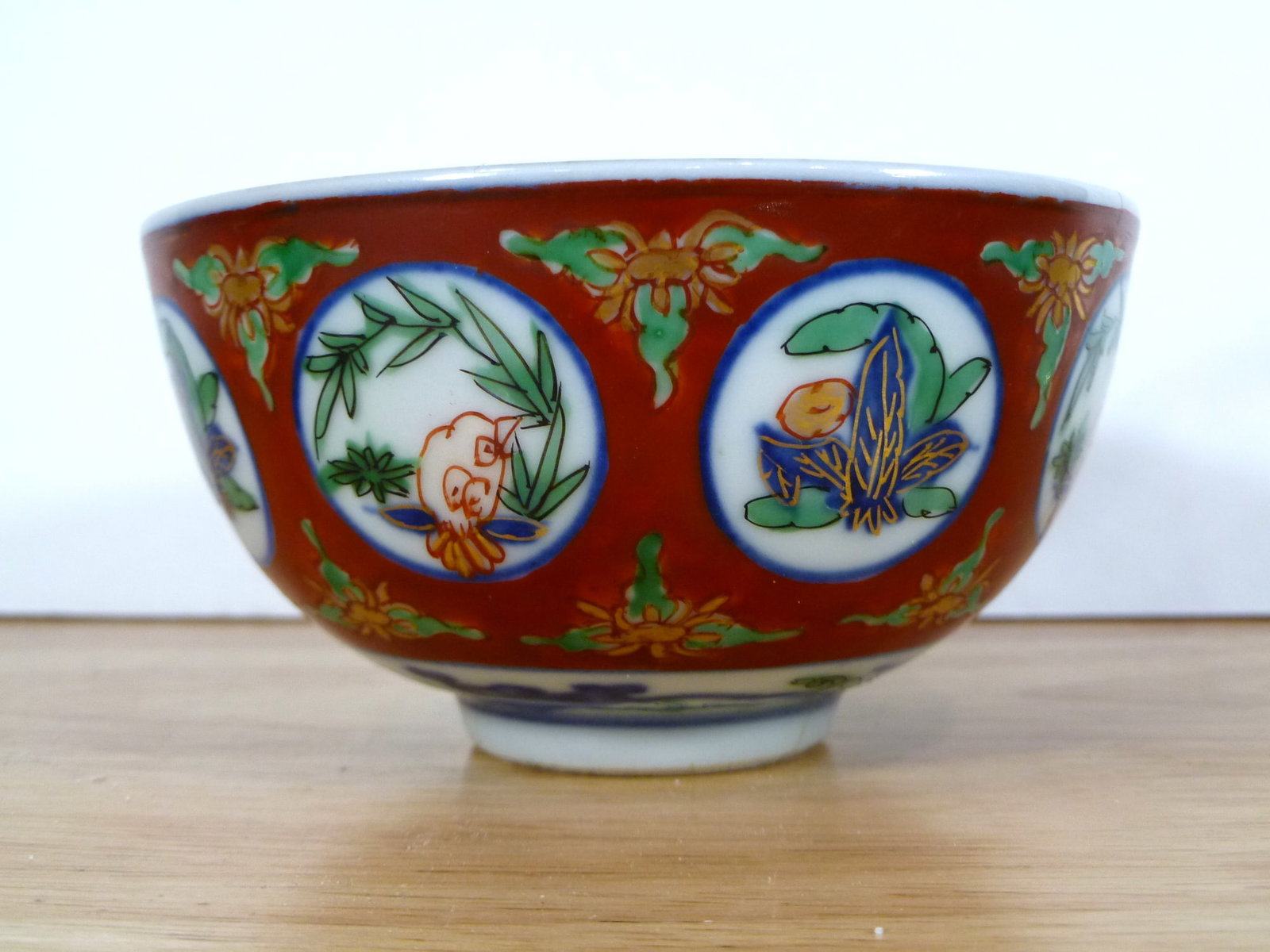 Chinese Red Glazed Blue and White Famille Rose Porcelain Bowl: Chinese Red Glazed Blue and White Famille Rose Porcelain Bowl. Diam 4.25", H 2.25". As Is.