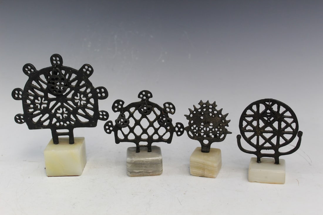Four Hatti Sun Disks on Marble Stands: Four Hatti Sun Disks on Marble Stands. biggest H with stand 15.5 cm