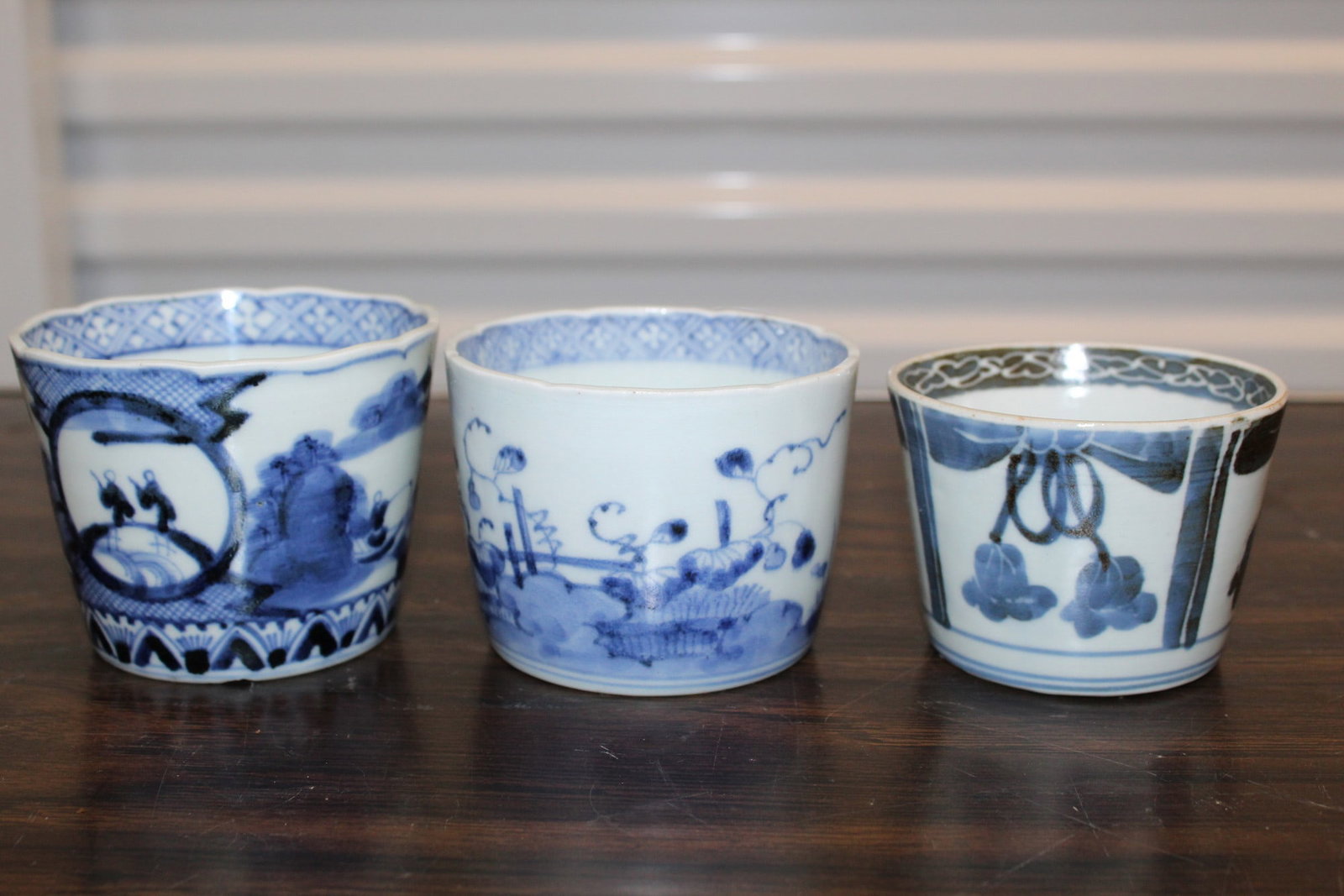 Three Japanese Blue and White Porcelain Cups.: Three Japanese Blue and White Porcelain Cups. . Tallest H 7.5 cm.