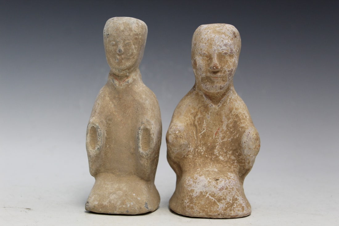 Two Chinese Pottery Figures: Two Chinese Pottery Figures. H 6".