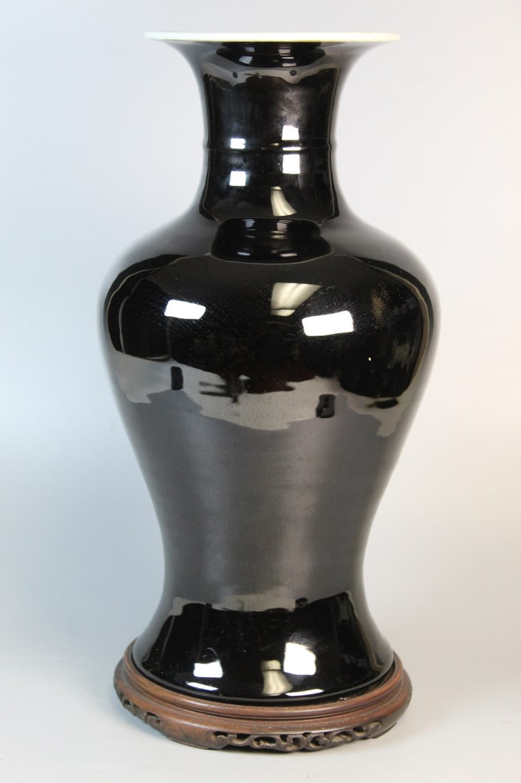 Chinese Mirror-black Glaze Porcelain Vase on Wood Stand: Chinese Mirror-black Glaze Porcelain Vase on Wood Stand. H 15". Diam 7.5". As Is.