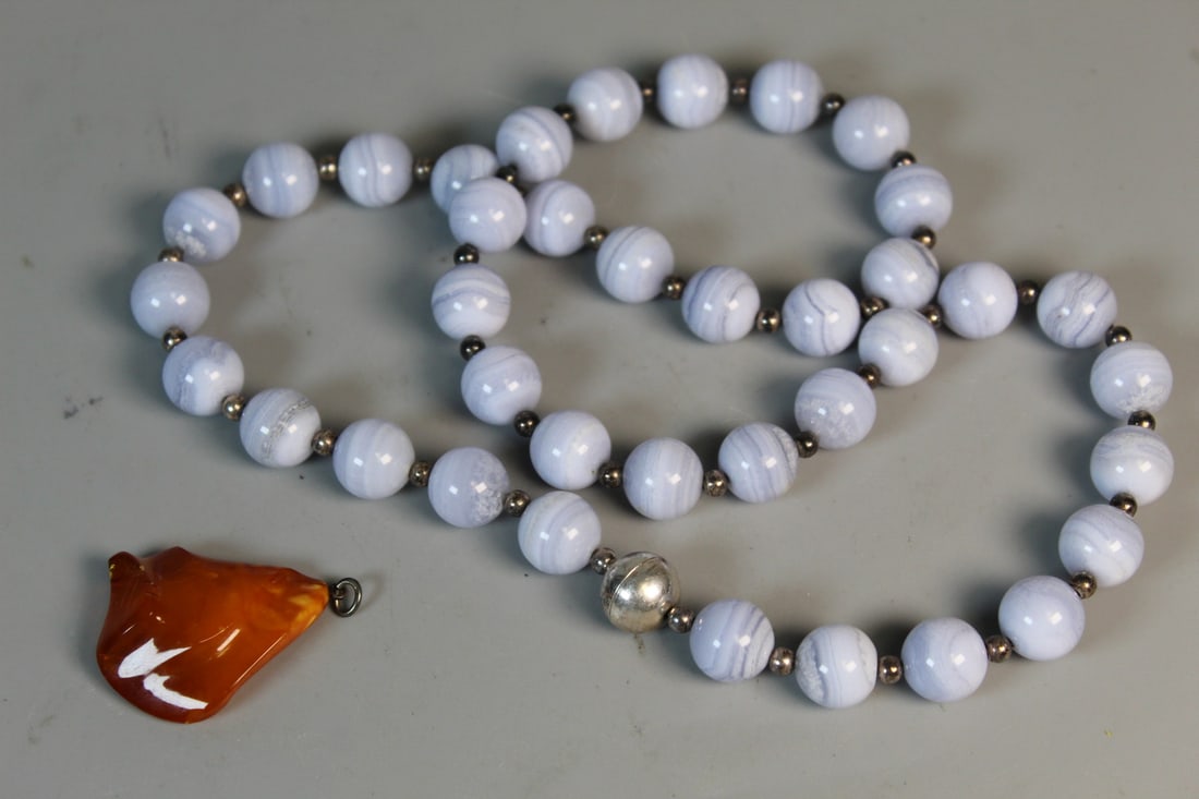 Amber Pendant and An Agate Beads Necklace: Amber Pendant and An Agate Beads Necklace. Pendant L 1.5". Necklace L 22".