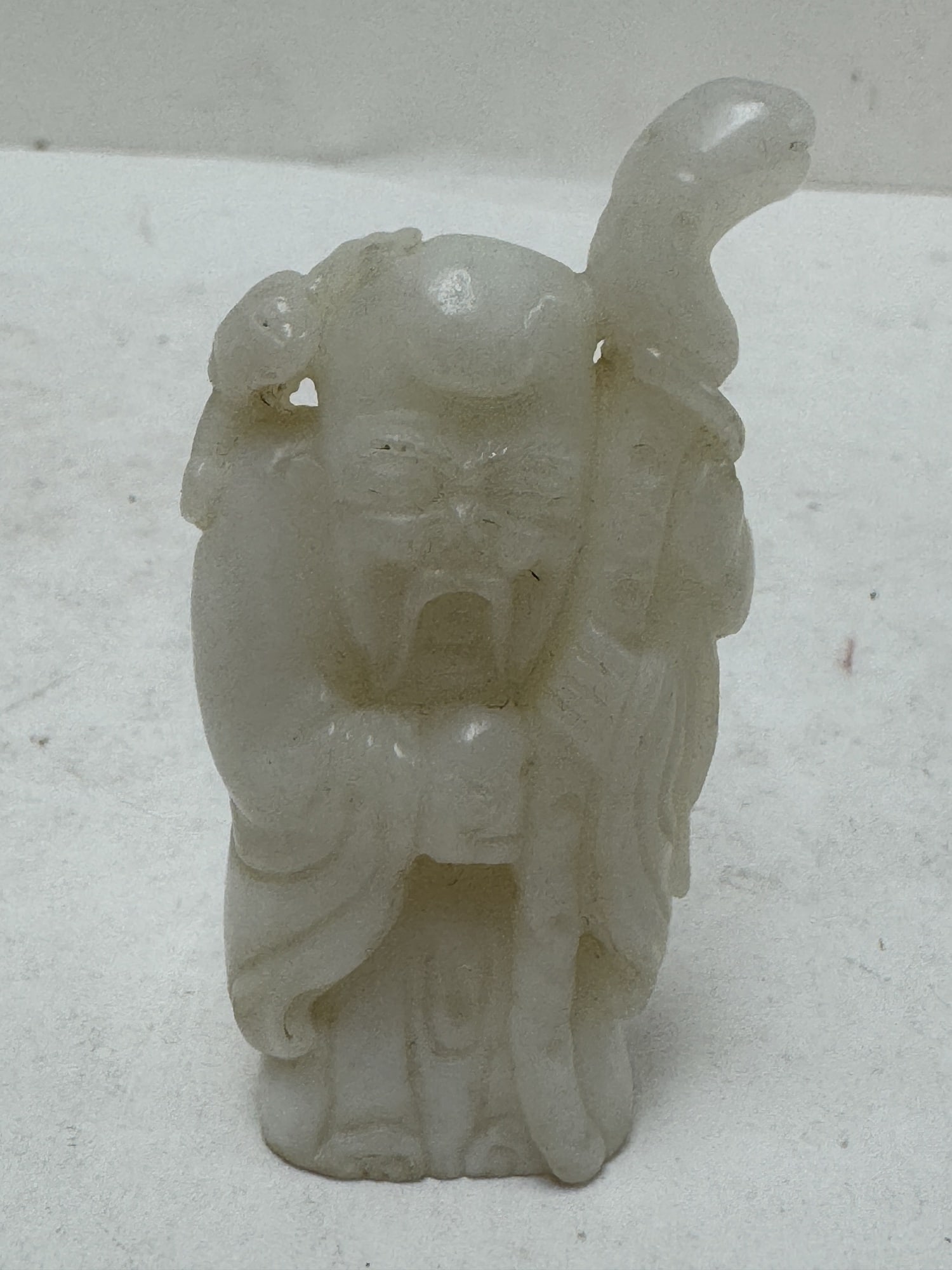 Chinese white jade carving of Shoulao (1 of 2)