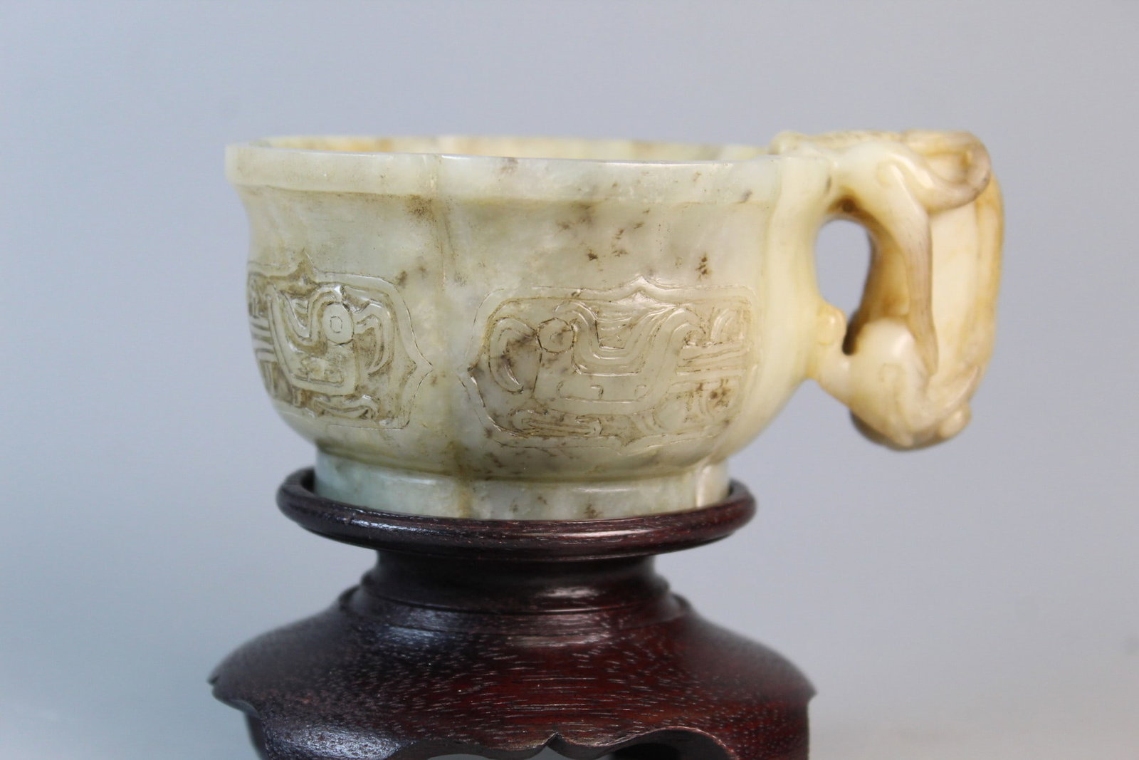 Chinese Carved Jade Cup on Wood Stand: Chinese Carved Jade Cup on Wood Stand. L 4.5". H 2".