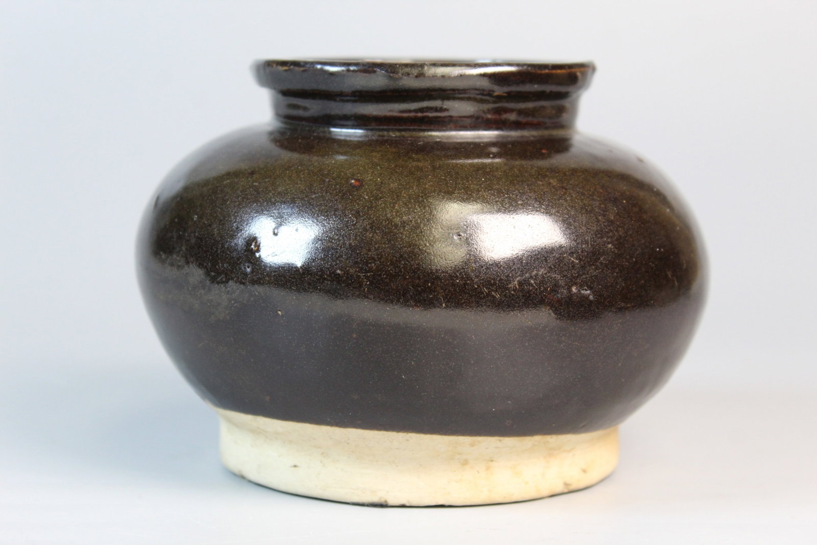 Chinese Dark Glazed Pottery Jar: Chinese Dark Glazed Pottery Jar. H 3.5", Diam 5".