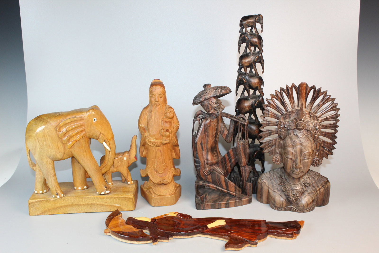 A Group of Asian Wood Carvings: A Group of Asian Wood Carvings. Tallest H 11.5".