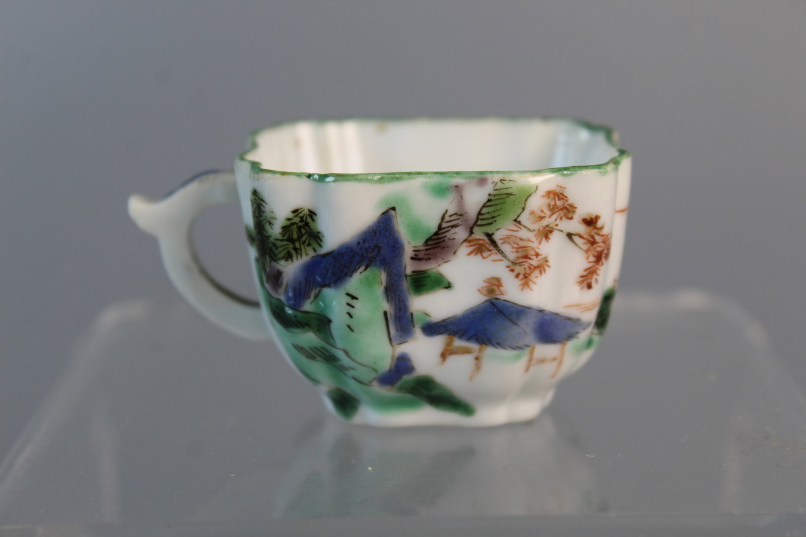 Chinese Famille Verte Porcelain Cup: Chinese Famille Verte Porcelain Cup. Kangxi period. L 2.25". H 1.5".