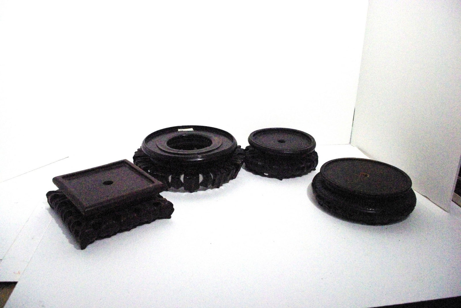 Lot of Four Ornate Wooden Bases: Lot of Four Ornate Wooden Bases. Largest Inner Rim Diam 6.125"