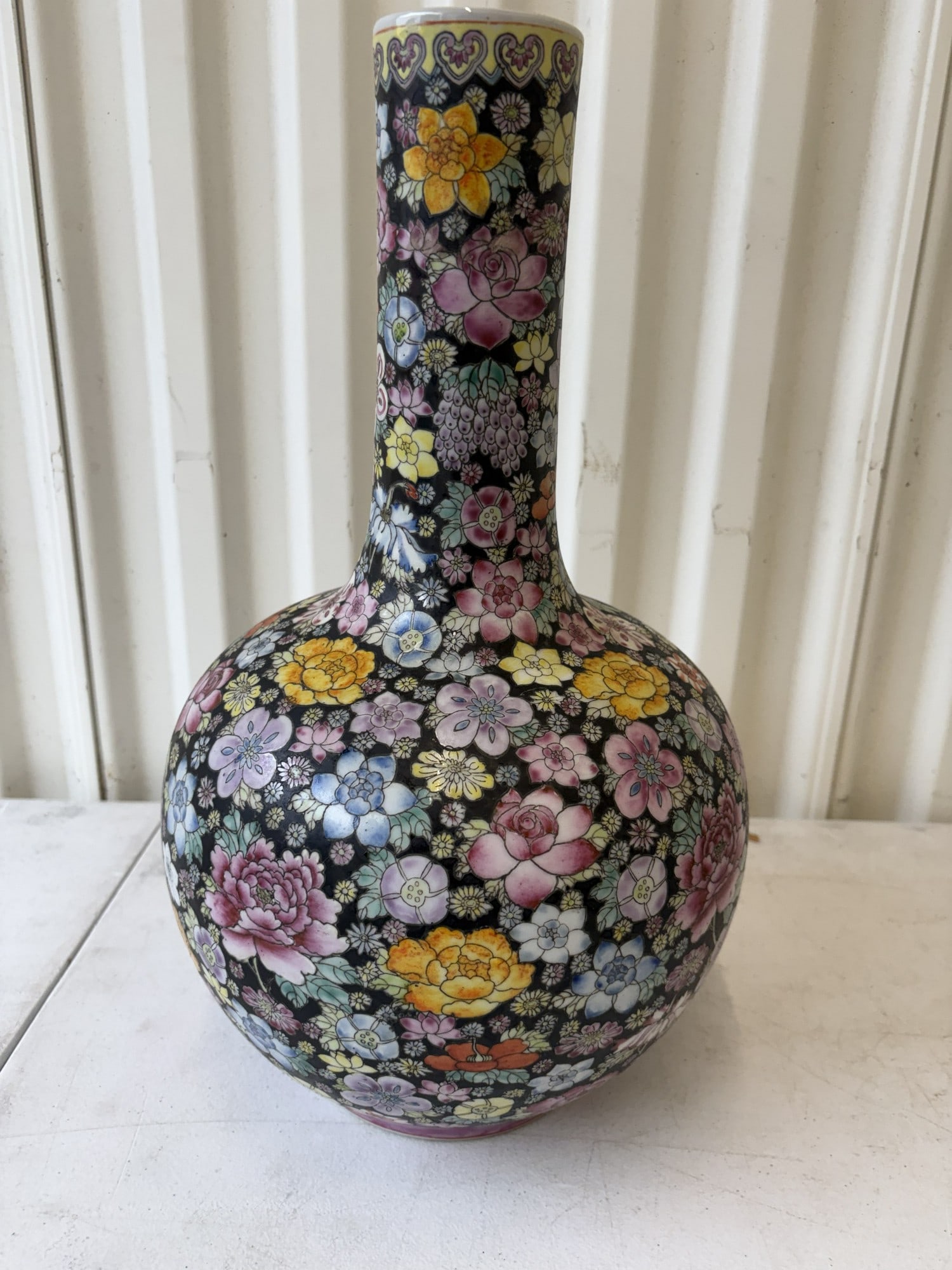 Chinese Famille Noire millefleur bottle vase: Chinese Famille Noire millefleur bottle vase. About 17" x 10"