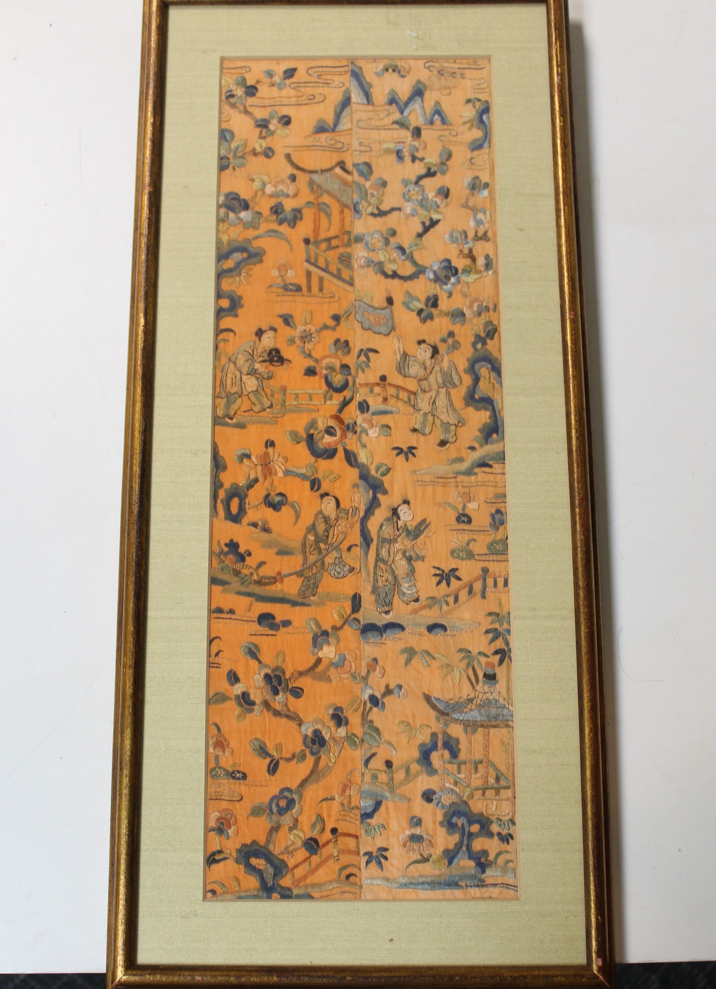 Chinese silk embroidery panel of children at play. Orange background. (1 of 4)