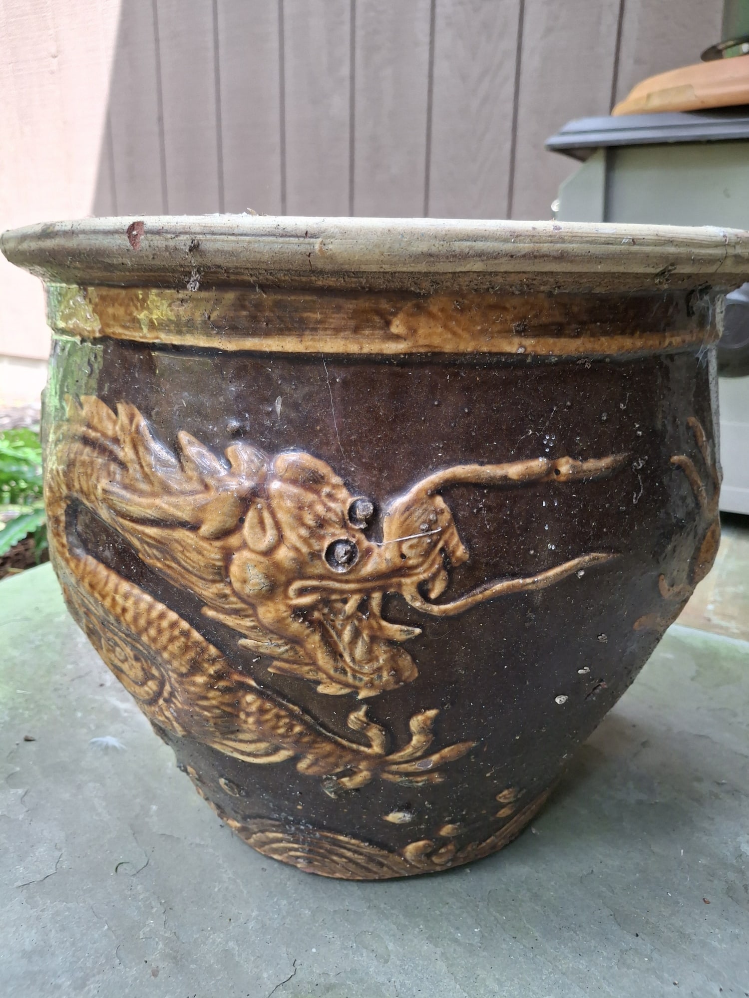 Chinese Brown Glazed Pottery Planter with Dragon Decoration: Chinese Brown Glazed Pottery Planter with Dragon Decoration. Diam 15". H 13".