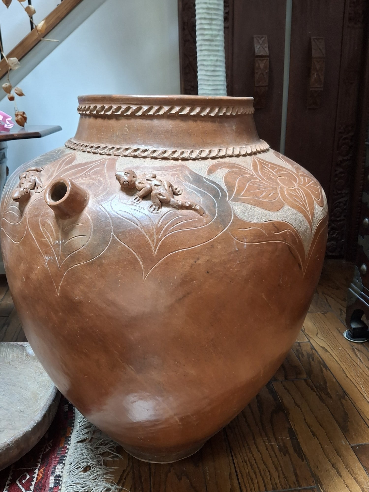Large Lombok Pottery Jar with Carved Flowers Decorations.: Large Lombok Pottery Jar with Carved Flowers Decorations. . H 34" Diam 28". Attention: The pickup location of this item is at Crownsville, MD 21032. Winning bidder will get address and pickup time thr