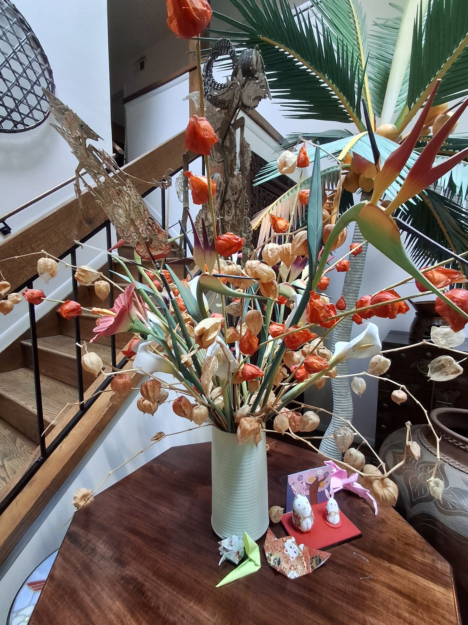 Dry Flowers in a Porcelain Vase and Indonesian Wayang Puppets: Dry Flowers in a Porcelain Vase and Indonesian Wayang Puppets . Vase H 11", Total H 43". Attention: The pickup location of this item is at Crownsville, MD 21032. Winning bidder will get address and pi