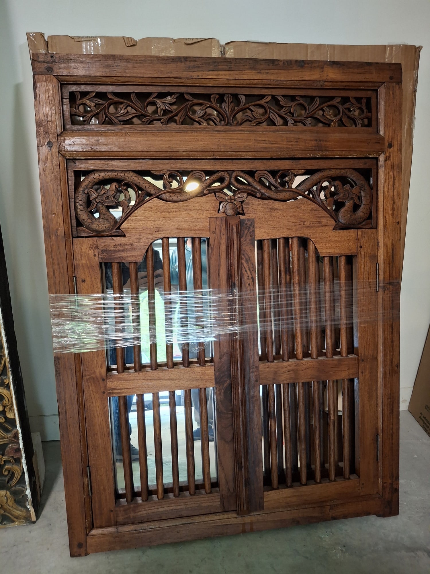 Asian Carved Wood Window with a Mirror Behind.: Asian Carved Wood Window with a Mirror Behind. . 42x31". As Is. Attention: The pickup location of this item is at Crownsville, MD 21032. Winning bidder will get address and pickup time through email. 