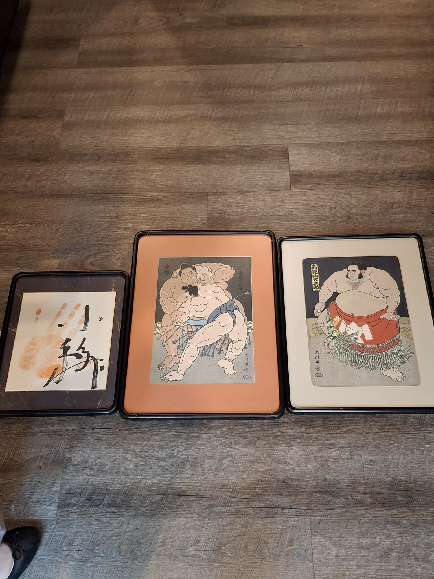 Two Japanese Sumo Woodblock Prints and a Sumo Palm Print.: Two Japanese Sumo Woodblock Prints and a Sumo Palm Print. . 10x14.5", Frame 21.5x15.5".