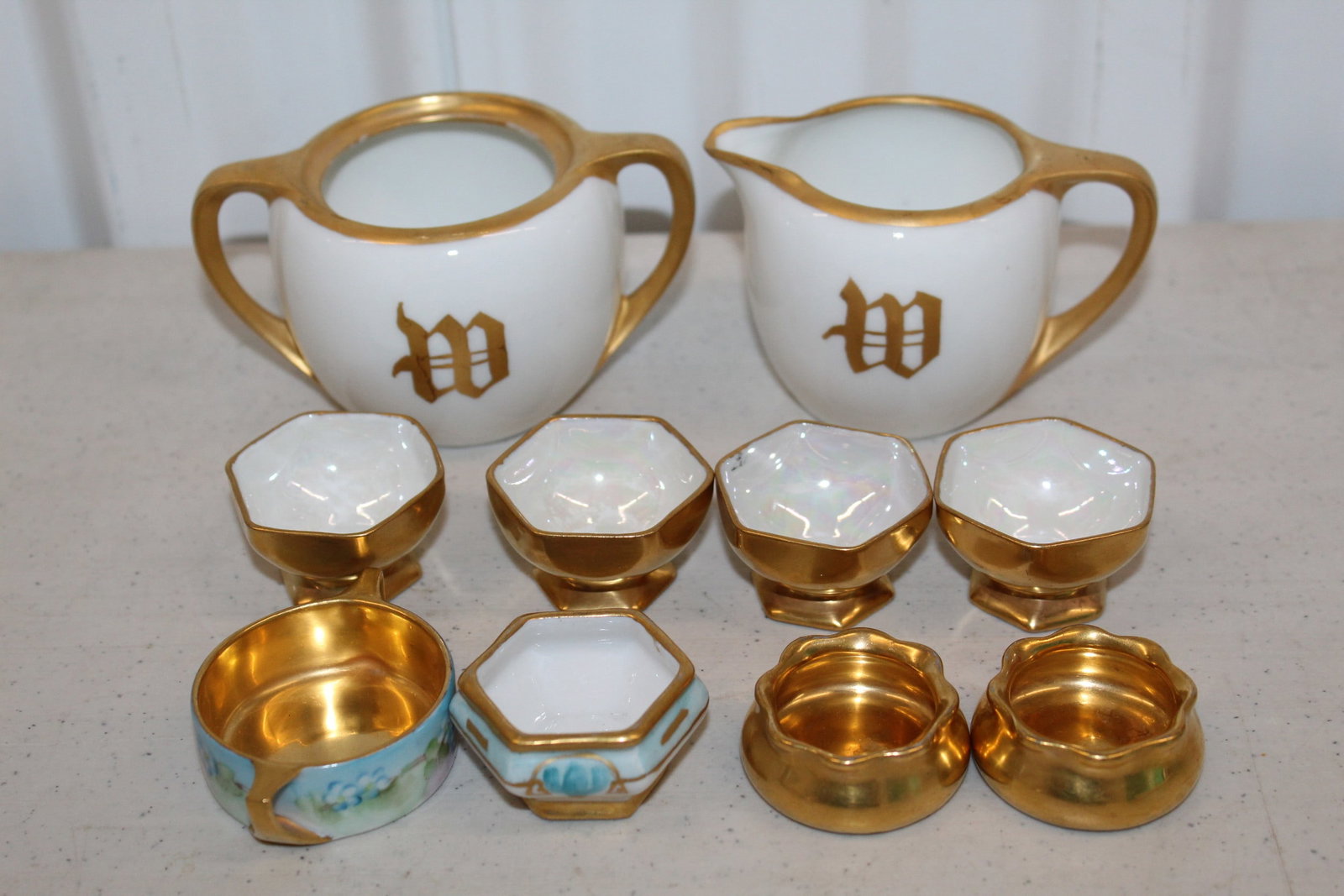 Gilt Decorated Porcelain Salt Dishes Creamer and Sugar Bowl: Gilt Decorated Porcelain Salt Dishes Creamer and Sugar Bowl. L 4.5". H 2.5".