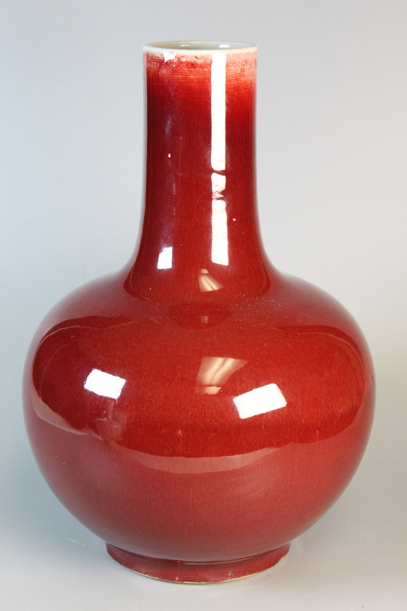 Chinese Ox-blood Glazed Porcelain Vase: Chinese Ox-blood Glazed Porcelain Vase. H 12.75'. Diam 8".