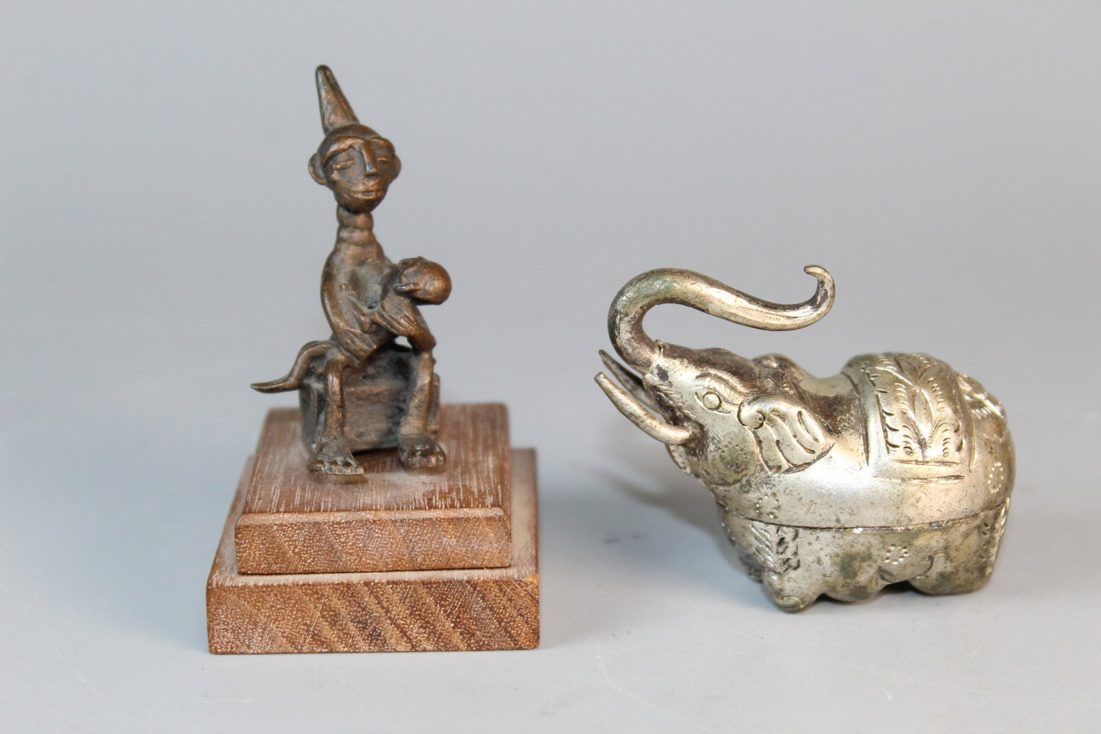 Thai Silver Elephant and A Small Bronze Figurine: Thai Silver Elephant and A Small Bronze Figurine . L 2". H 2'.