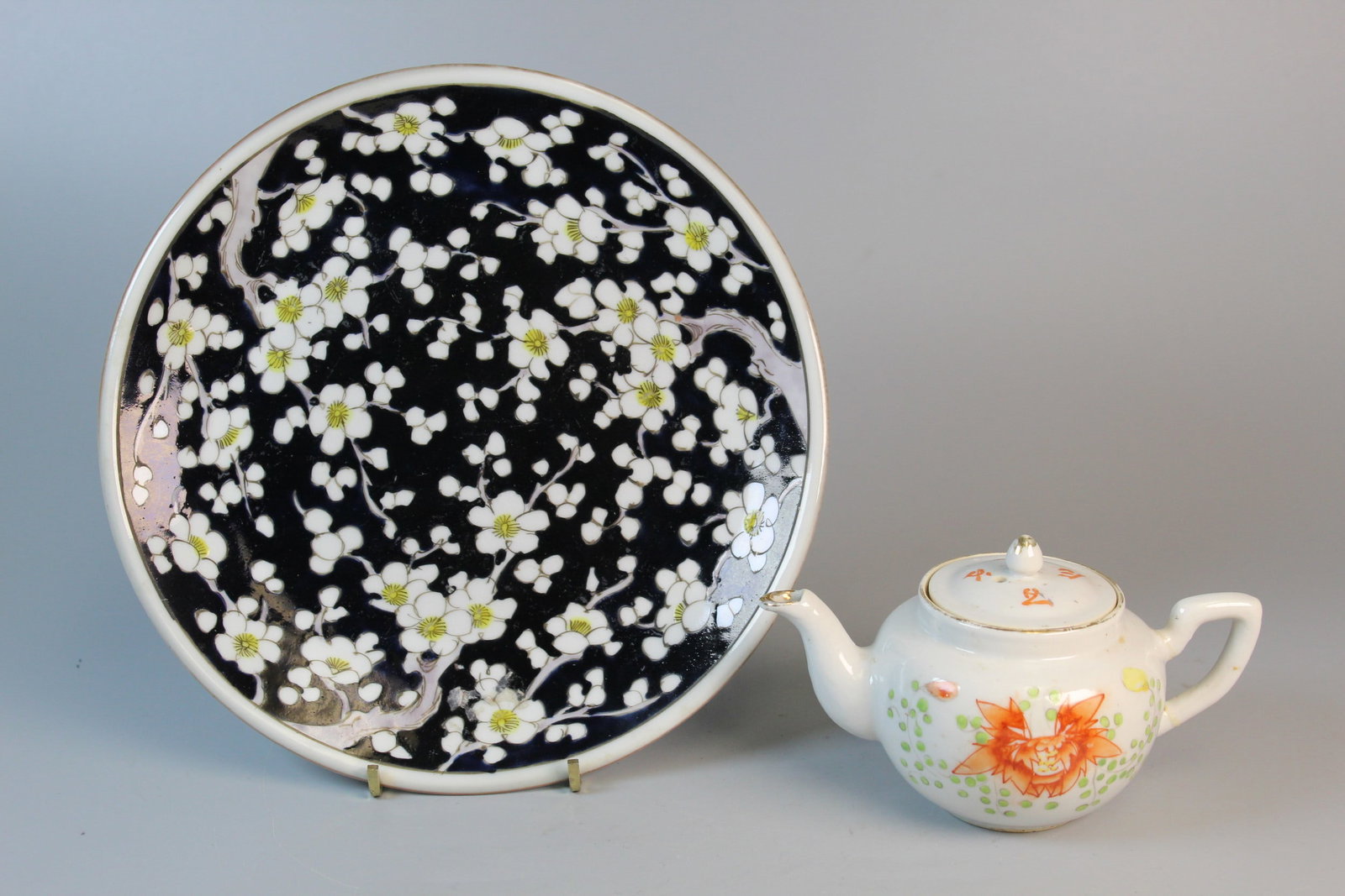 Asian Porcelain Teapot and Plate: Asian Porcelain Teapot and Plate. Diam 8.5". Teapot L 5.5". As Is.