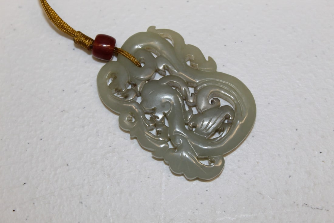 Chinese Carved Celadon Jade Pendant: Chinese Carved Celadon Jade Pendant. Size 6 x 4 x 0.5 cm.