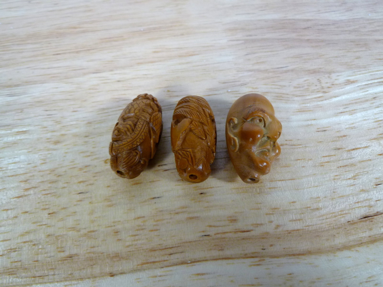 Three Chinese Carved Olive Nuts (1 of 3)