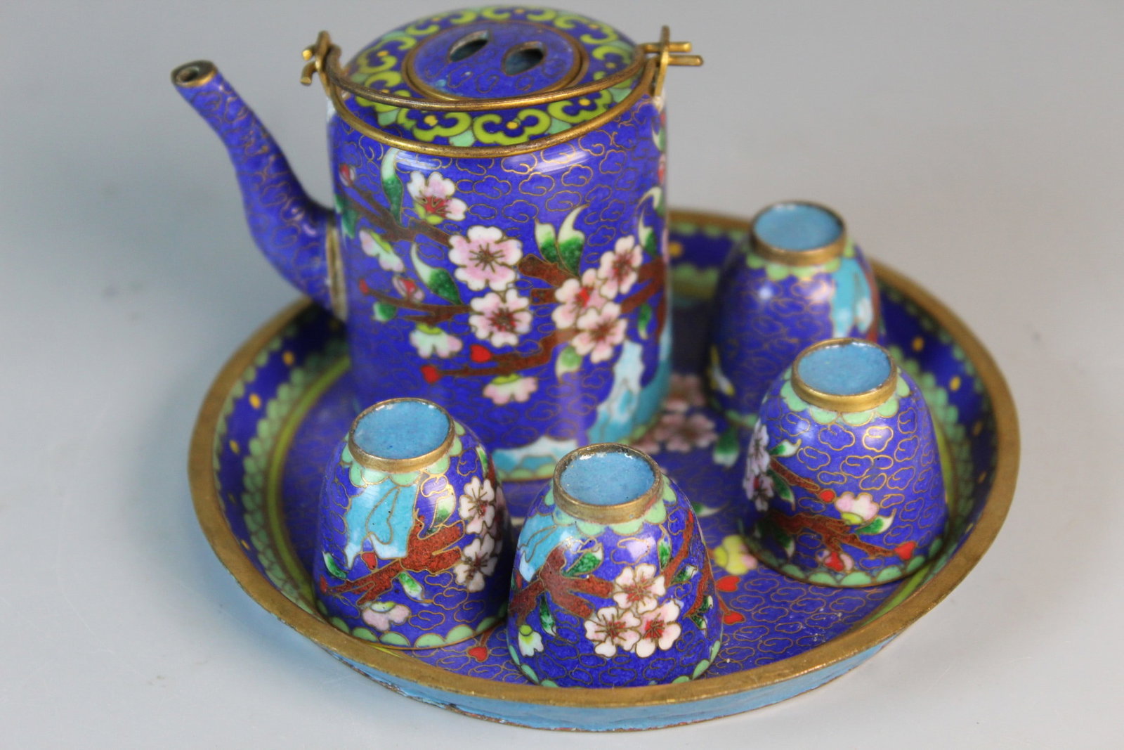 Chinese Cloisonne Miniature Tea Set: Chinese Cloisonne Miniature Tea Set. Diam of saucer 4.5".