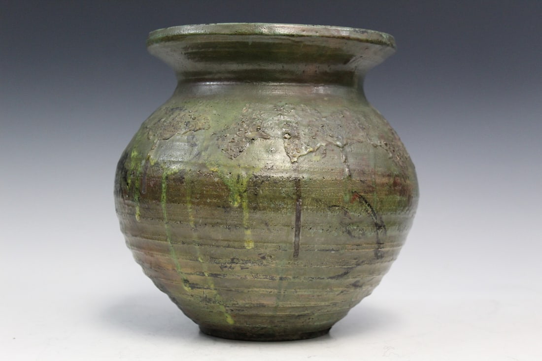 Green Glazed Art Pottery Jar: Green Glazed Art Pottery Jar. Signed. H 9.5".