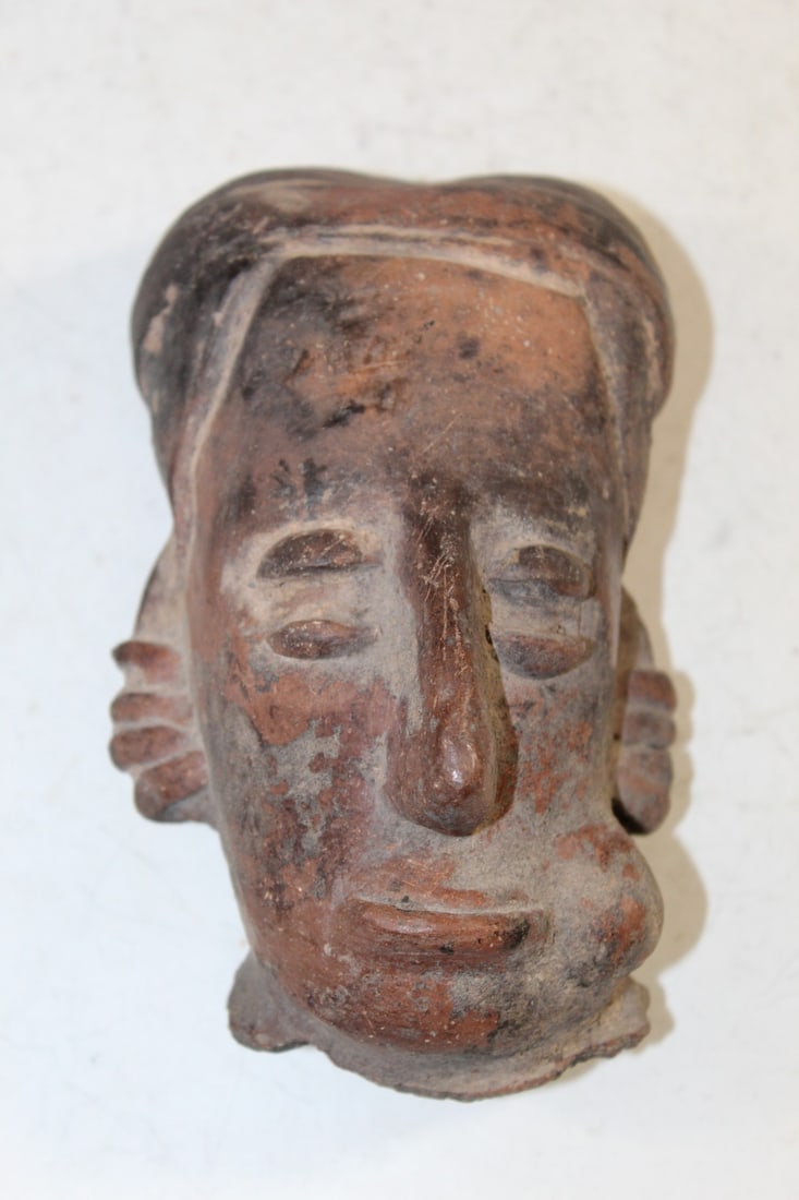Colima Head of a Man Chewing Tobacco or Similar Substance.: Colima Head of a Man Chewing Tobacco or Similar Substance.. 500-1000 CE. Terracotta with black and red pigment. H 6".