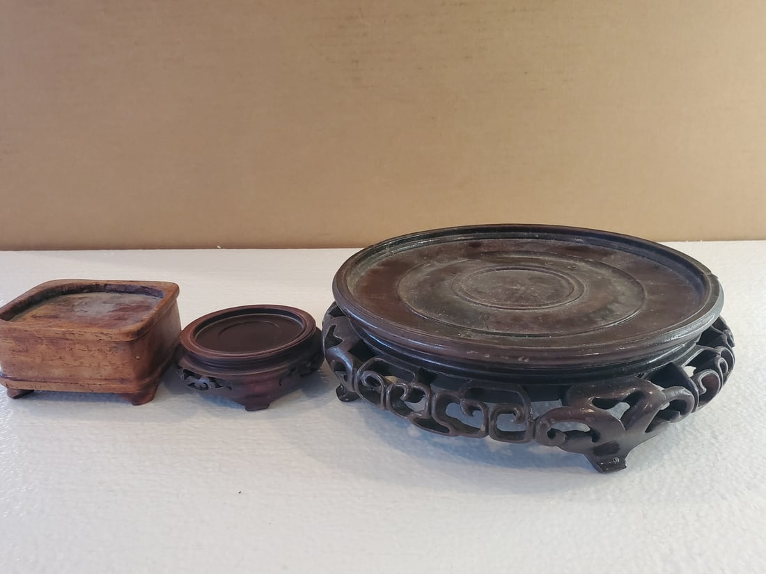 Chinese wood stands: Chinese wood stands. Largest diameter 8". Smallest diameter 3".