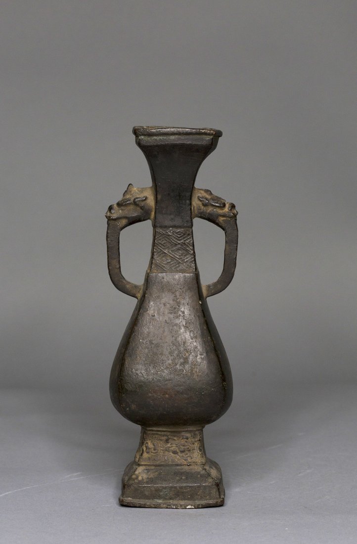 A SMALL BRONZE VESSEL (1 of 5)
