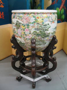 Huge Chinese famille rose porcelain jardiniere with: Huge Chinese famille rose porcelain jardiniere with wood stand. Total height 93 cm. Jardiniere height 46 cm. Rim diameter 50 cm. Provenance: A PA estate.