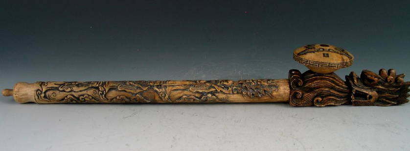 Chinese carved opium pipe.: Chinese carved opium pipe. Length 48 cm. diameter 7 cm.