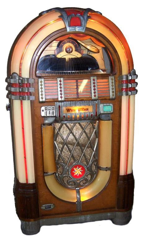 Vintage Wurlitzer Jukebox: Jukebox has Model 1015 cabinet with Model 2200 player conversion for 45 rpm records, runs from a Wurlitzer wall box.