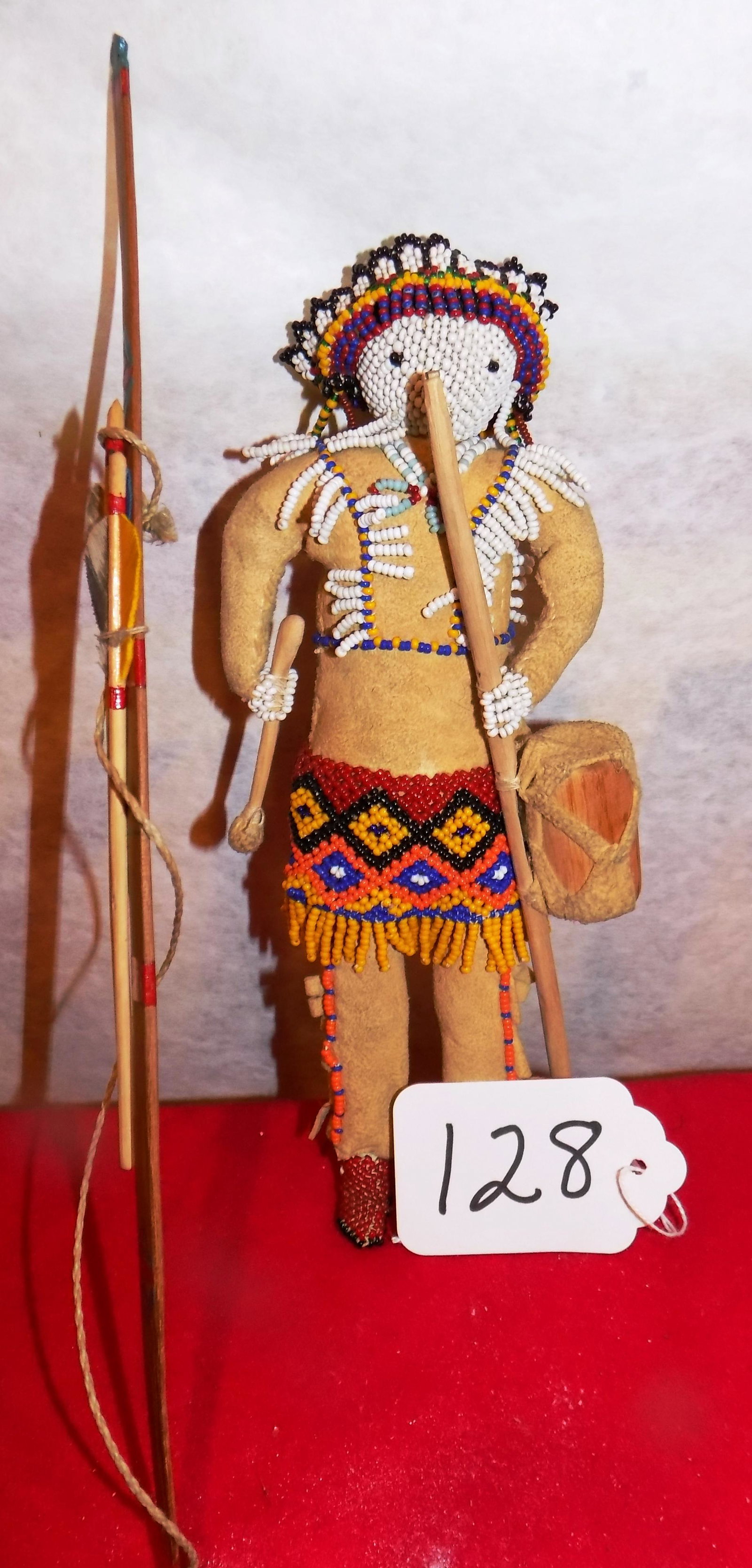Doll: 9" Beaded Native American doll with bow & arrows, feather fletching, drum, wood spear, beaded headdress